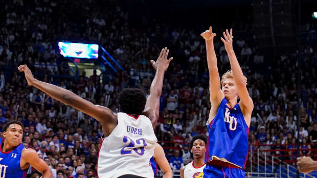 Oct 14, 2022; Lawrence, Kansas, US; Kansas Jayhawks guard Gradey Dick (4) shoots over center Ernest Udeh Jr. (23) in a scrimmage during Late Night at the Phog at Allen Fieldhouse.